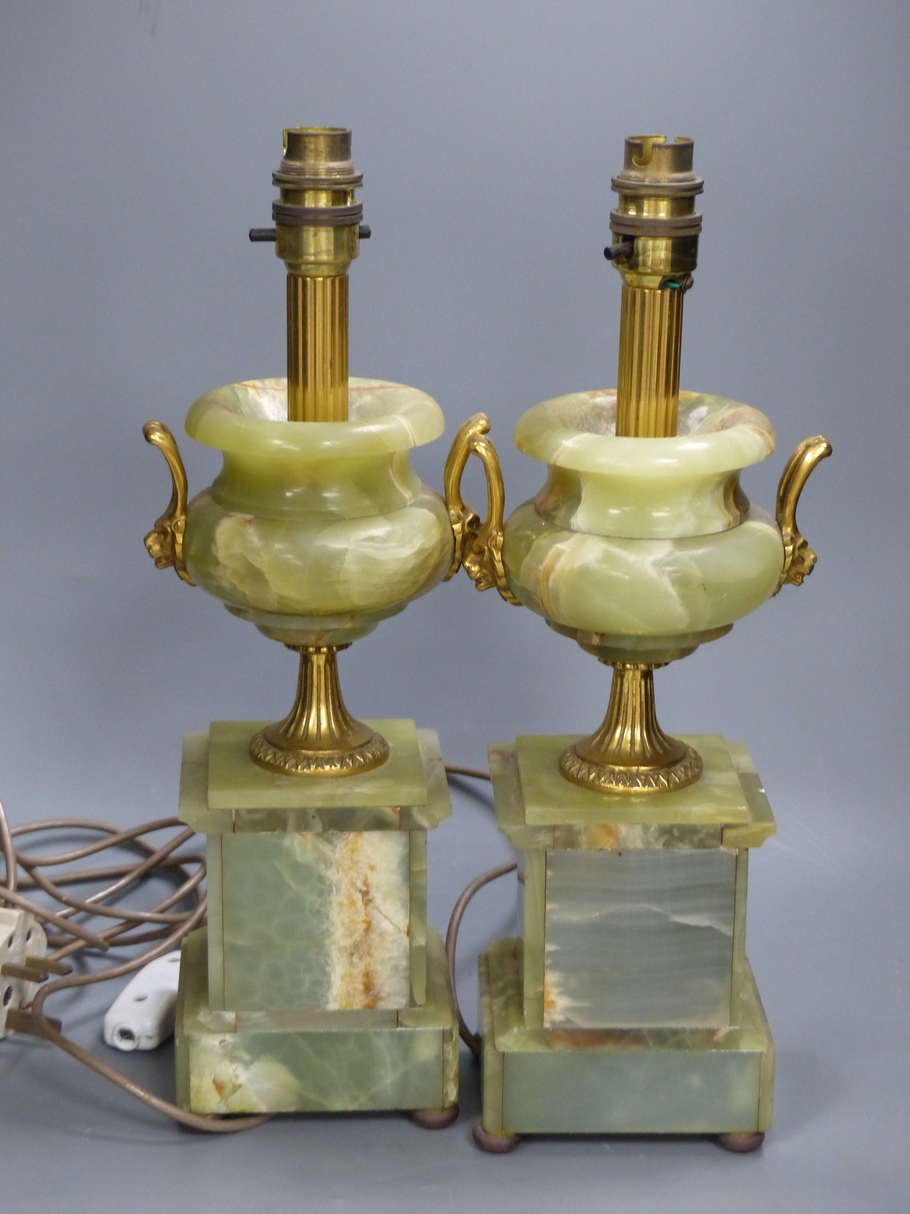 A pair of green onyx and gilt metal twin-handled pedestal urn table lamps, height 37cm